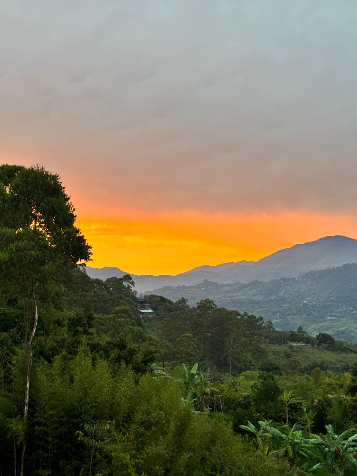 Fiery sunset over green Colombian mountain valley